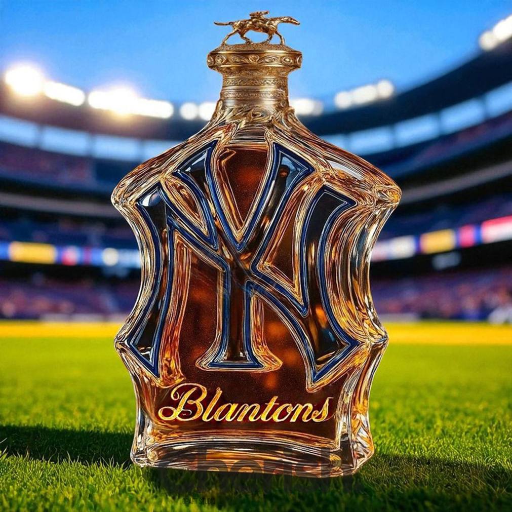 New York Yankees NY-shaped whiskey bottle branded with Blanton's, topped with a racehorse stopper on a baseball stadium field