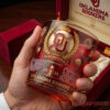 Oklahoma Sooners NCAA Champion 2026 Edition Whiskey Glass inside a premium red velvet lined display box