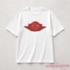White oversize t-shirt featuring red Air Jordan Wings logo graphic printed on chest