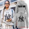 New York Yankees x Jay-Z Fear Of God Hoodie in grey, modeled by a woman, with front and back design views