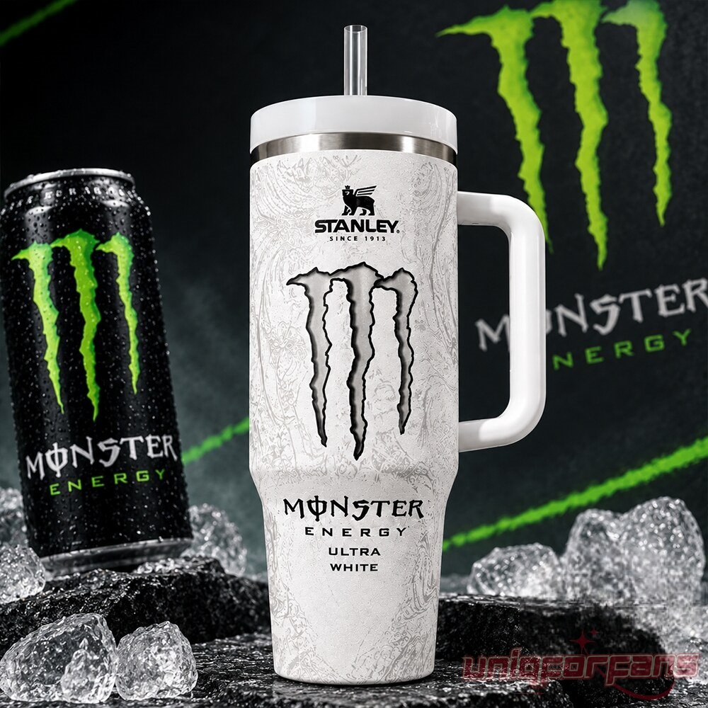 Stanley Monster Energy Ultra White 40 oz tumbler with straw next to a Monster Energy can on ice