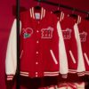 Bruno Mars Hello Kitty Romantic Tour Red Bomber Jacket displayed hanging on a rack