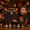 Cleveland Browns Football Halloween 2026 Advent Calendar held by a smiling boy wearing a team hoodie