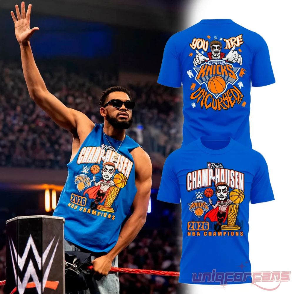 Danhausen x NYK Champhausen 2026 NBA Champions T-Shirt in blue with Danhausen cartoon graphic and Uncursed back print