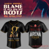 Garth Brooks Arena Tour baseball jersey in black with gold trim, featuring a large gold 'g' logo and arms-outstretched concert graphic