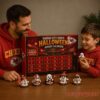 Kansas City Chiefs Football Halloween 2026 Advent Calendar held by a father and son wearing red Chiefs hoodies