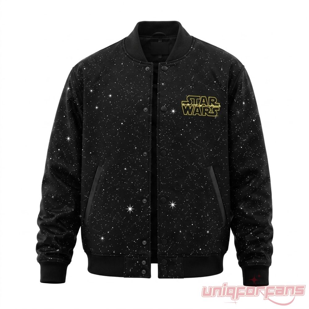 Ryan Gosling Star Wars Starfighter Varsity Bomber Jacket front view in black with starry print and yellow Star Wars logo